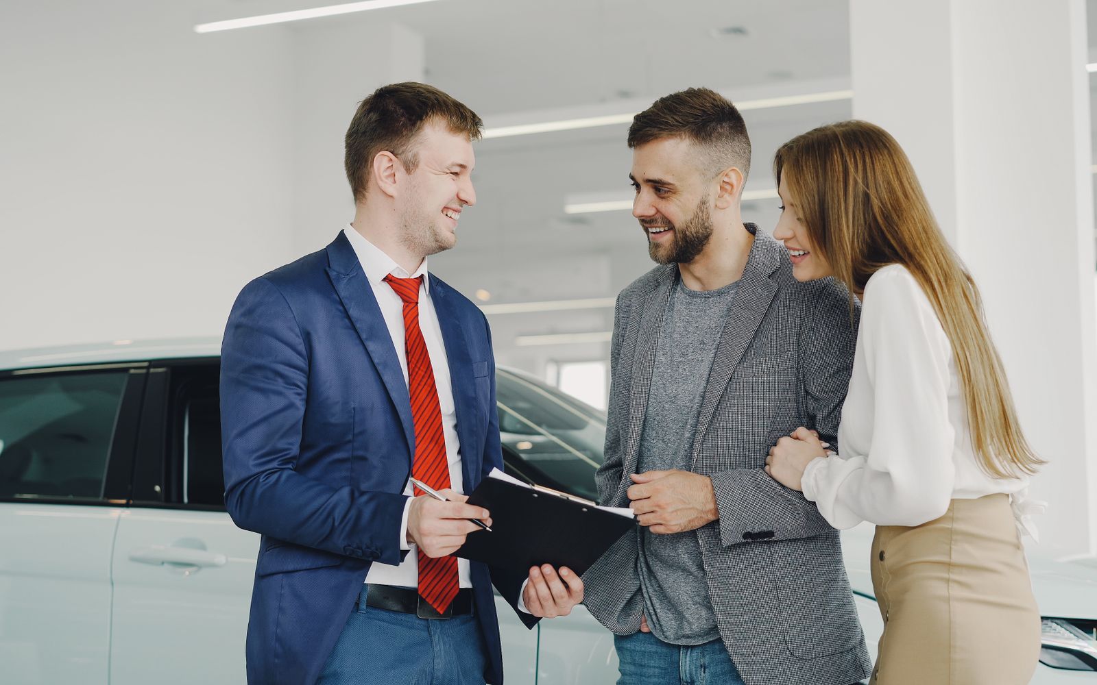 Finance manager reviewing loan terms with a customer at a desk